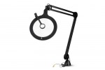 Magnifying lamps with articulated arm